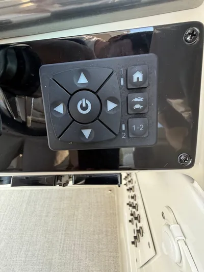  Yacht Photos Pics Control panel of 2024 Formula 350 Crossover Bowrider with directional buttons and power symbol.