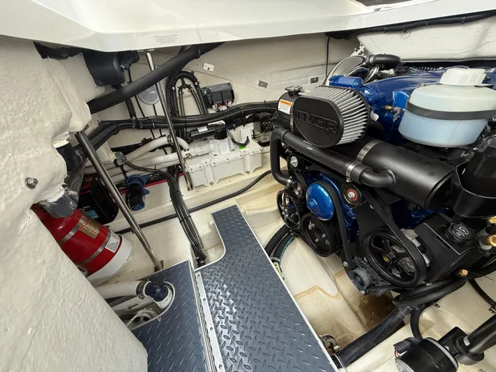  Yacht Photos Pics Engine compartment of 2024 Formula 350 Crossover Bowrider, showcasing detailed mechanical components.