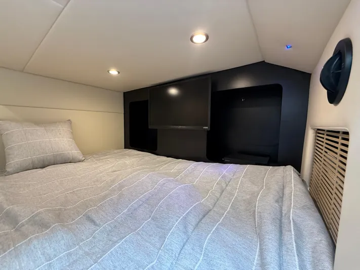  Yacht Photos Pics 2024 Formula 350 Crossover Bowrider cabin with bed and TV, modern interior design.