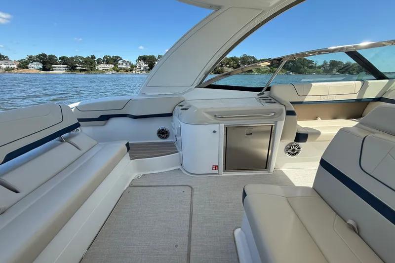  Yacht Photos Pics 2024 Formula 350 Crossover Bowrider interior with luxurious seating and scenic water view.