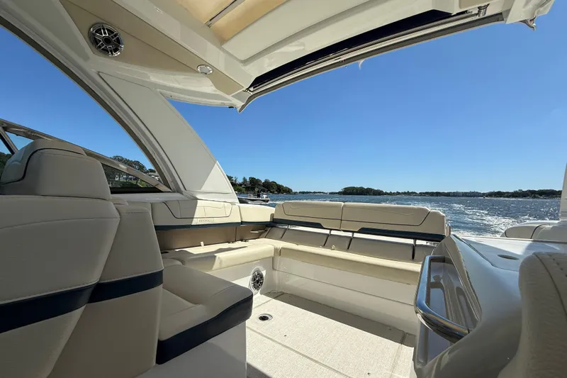  Yacht Photos Pics 2024 Formula 350 Crossover Bowrider interior with open deck, overlooking serene waters.