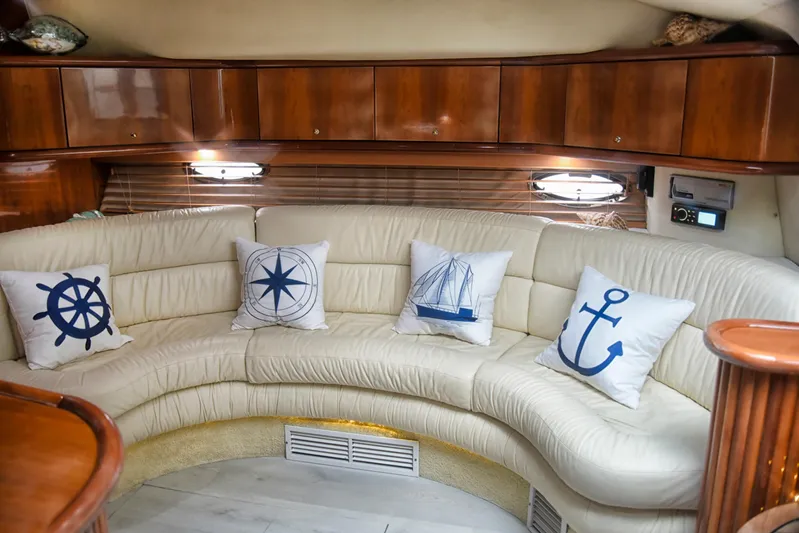  Yacht Photos Pics Luxurious 2001 Sunseeker 44 Camargue yacht interior with nautical-themed cushions.