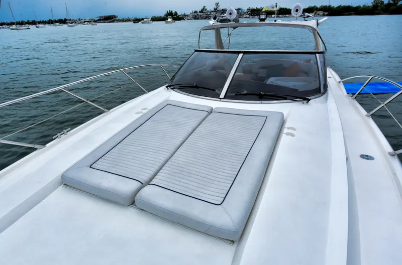  Yacht Photos Pics 2001 Sunseeker 44 Camargue yacht on water, featuring spacious deck and sleek design.