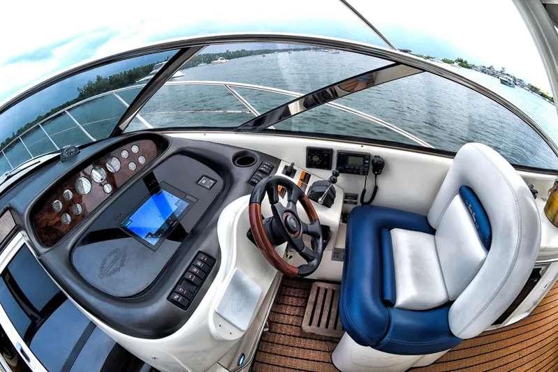  Yacht Photos Pics Sunseeker 44 Camargue 2001 yacht helm with modern controls and panoramic water view.
