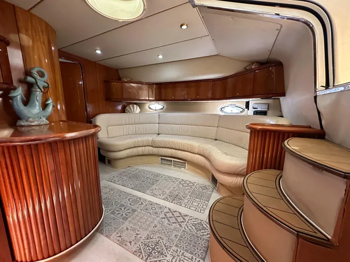  Yacht Photos Pics Luxurious interior of 2001 Sunseeker 44 Camargue yacht with elegant seating and wood finishes.