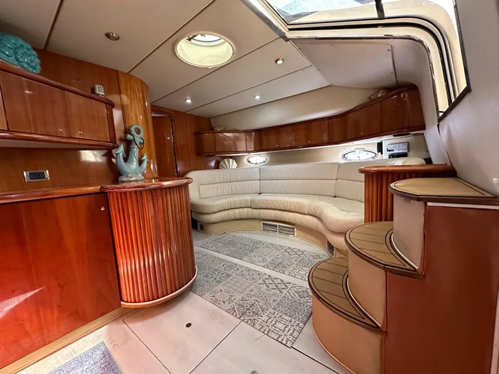  Yacht Photos Pics Luxurious 2001 Sunseeker 44 Camargue yacht interior with elegant wood and leather furnishings.