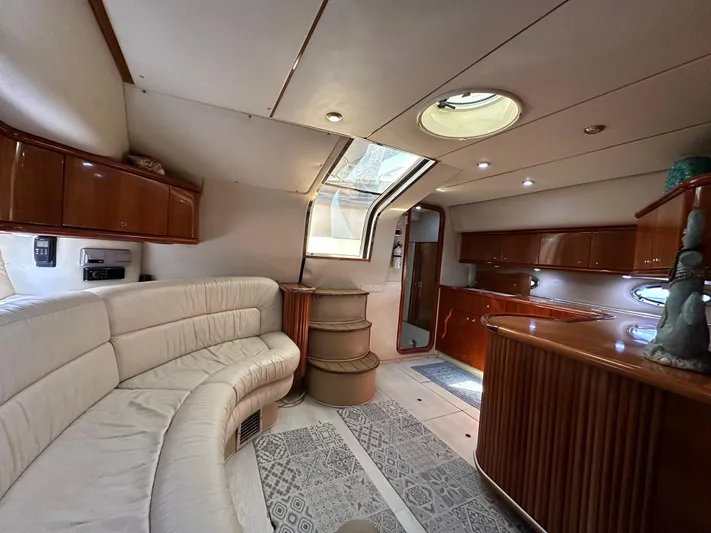  Yacht Photos Pics Luxurious interior of 2001 Sunseeker 44 Camargue yacht with elegant seating and wood finishes.