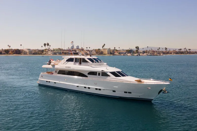 Reverie Yacht Photos Pics Luxury yacht cruising near coastal city, 2005 C Custom model.