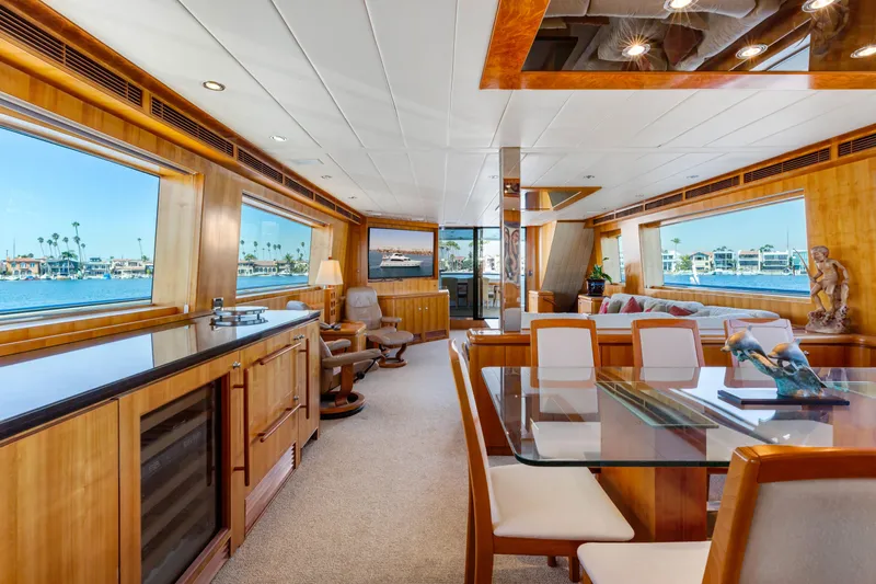 Reverie Yacht Photos Pics Luxurious 2005 custom yacht interior with elegant wood finishes and panoramic ocean views.