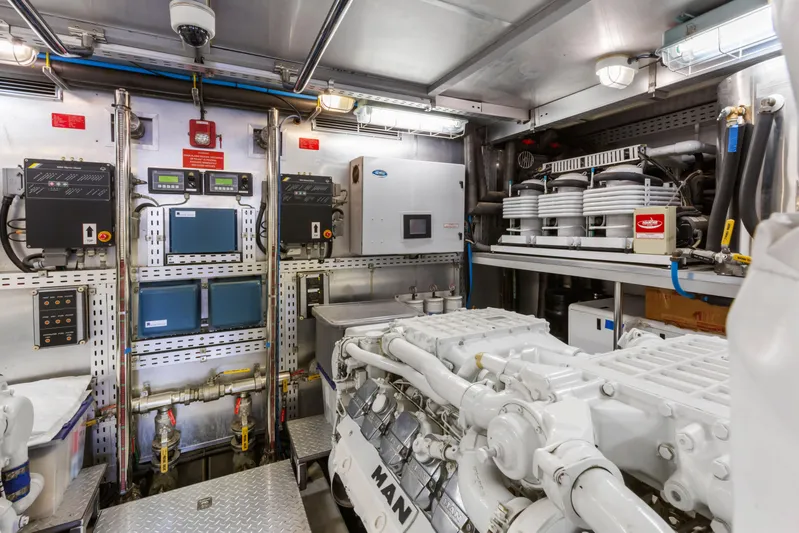 Reverie Yacht Photos Pics Engine room with advanced machinery and control panels, featuring a 2005 C Custom model.