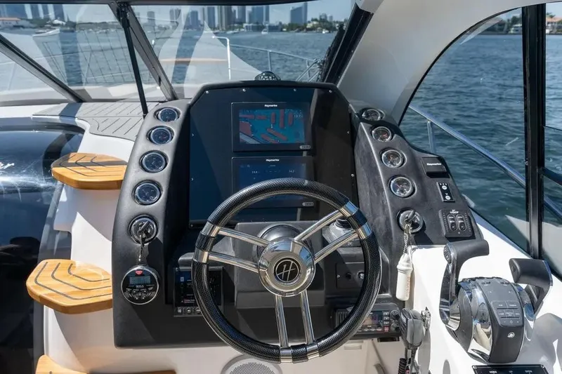  Yacht Photos Pics Cockpit of 2025 Hanover 375 yacht with modern navigation controls and steering wheel.