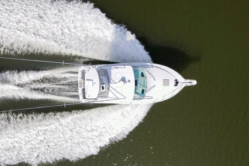 2017 Cummins 540s And Major Re-fit Throughout Yacht Photos Pics Overhead view of a 1995 Cabo 35 Express boat cruising on water.