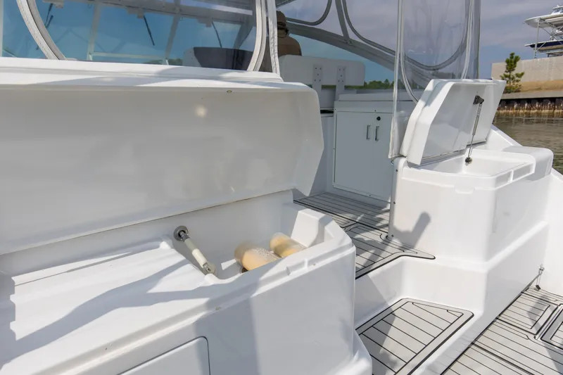 2017 Cummins 540s And Major Re-fit Throughout Yacht Photos Pics 1995 Cabo 35 Express boat interior with open storage compartments and clean deck.
