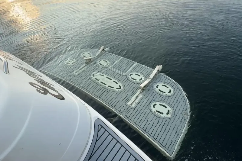 Empty Pockets Yacht Photos Pics Partially submerged 1999 Sea Ray 460 Sundancer boat in calm water.