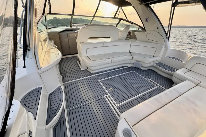 Empty Pockets Yacht Photos Pics Spacious interior of 1999 Sea Ray 460 Sundancer yacht with elegant seating and scenic water view.