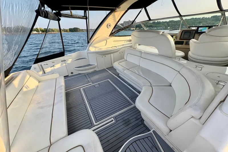 Empty Pockets Yacht Photos Pics Luxurious 1999 Sea Ray 460 Sundancer yacht interior with white seating and scenic water view.