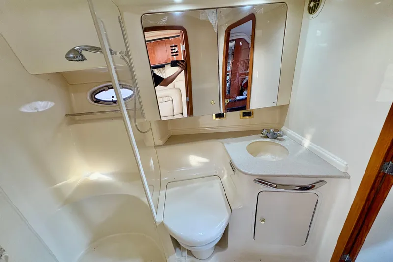 Empty Pockets Yacht Photos Pics Bathroom interior of 1999 Sea Ray 460 Sundancer yacht with shower and sink.