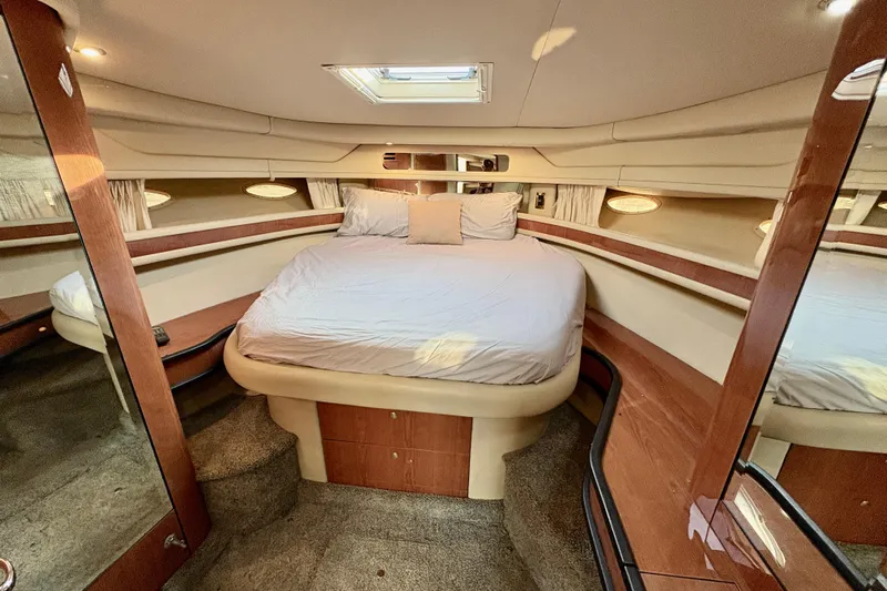 Empty Pockets Yacht Photos Pics Luxurious cabin interior of 1999 Sea Ray 460 Sundancer yacht with cozy bed.