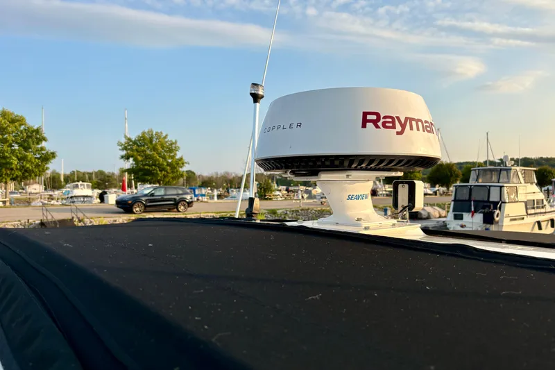 Empty Pockets Yacht Photos Pics Radar equipment on a 1999 Sea Ray 460 Sundancer yacht at a marina.