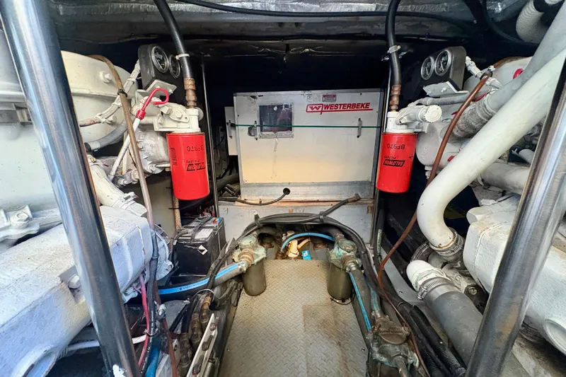 Empty Pockets Yacht Photos Pics Engine room of 1999 Sea Ray 460 Sundancer with Westerbeke generator and filters.