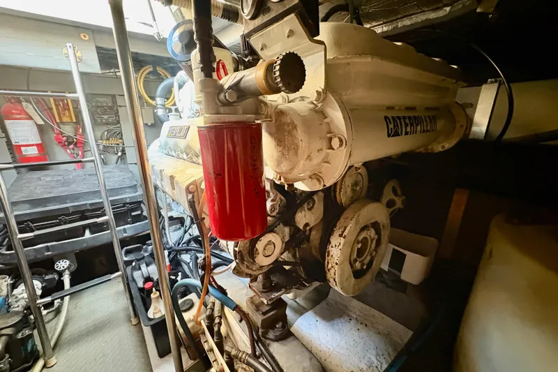 Empty Pockets Yacht Photos Pics Engine room of 1999 Sea Ray 460 Sundancer with Caterpillar engine components.