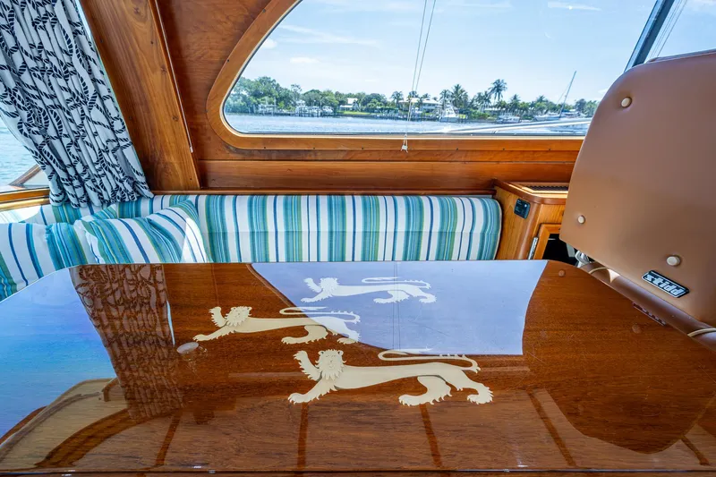 Lionheart Yacht Photos Pics Luxurious interior of 2008 Hinckley Talaria 44 FB yacht with elegant wood detailing.