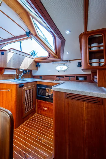 Lionheart Yacht Photos Pics Luxurious 2008 Hinckley Talaria 44 FB yacht interior with wooden cabinetry and modern amenities.