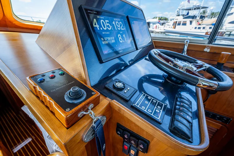 Lionheart Yacht Photos Pics Helm of 2008 Hinckley Talaria 44 FB yacht with navigation controls and display.