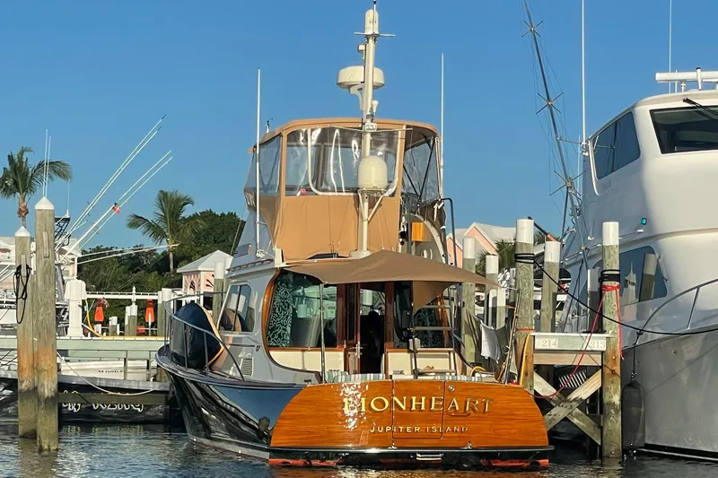 Lionheart Yacht Photos Pics 2008 Hinckley Talaria 44 FB yacht docked at marina, sunny day.