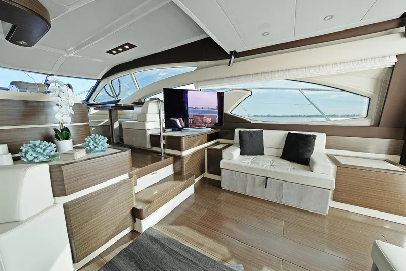 Acciaio Blu Yacht Photos Pics Luxurious interior of 2017 Azimut 60 Flybridge yacht with modern seating and elegant decor.