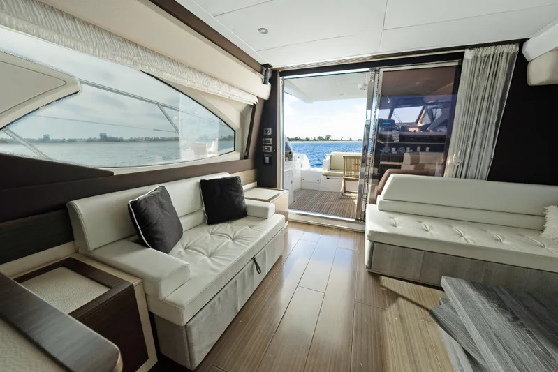 Acciaio Blu Yacht Photos Pics Luxurious interior of 2017 Azimut 60 Flybridge yacht with elegant seating and ocean view.