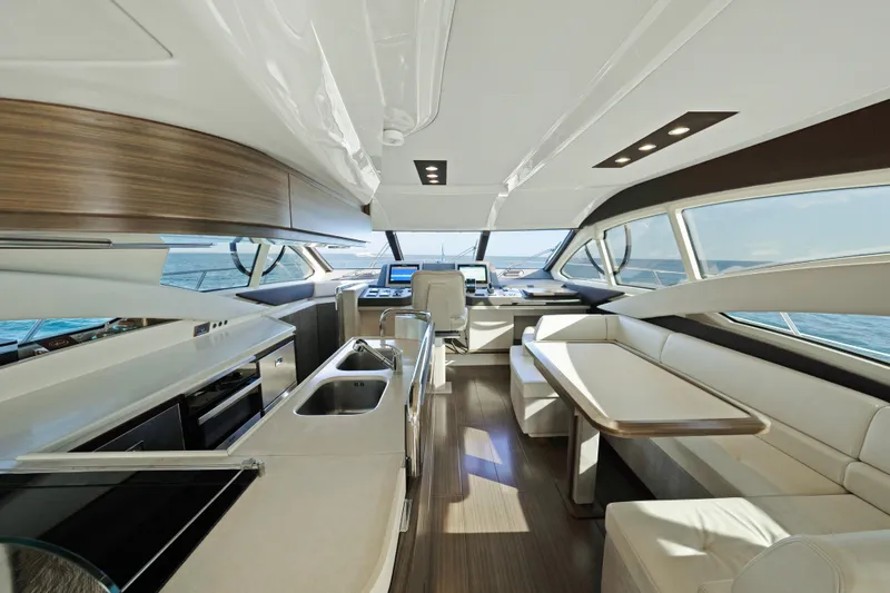 Acciaio Blu Yacht Photos Pics Luxurious interior of 2017 Azimut 60 Flybridge yacht with modern kitchen and seating area.