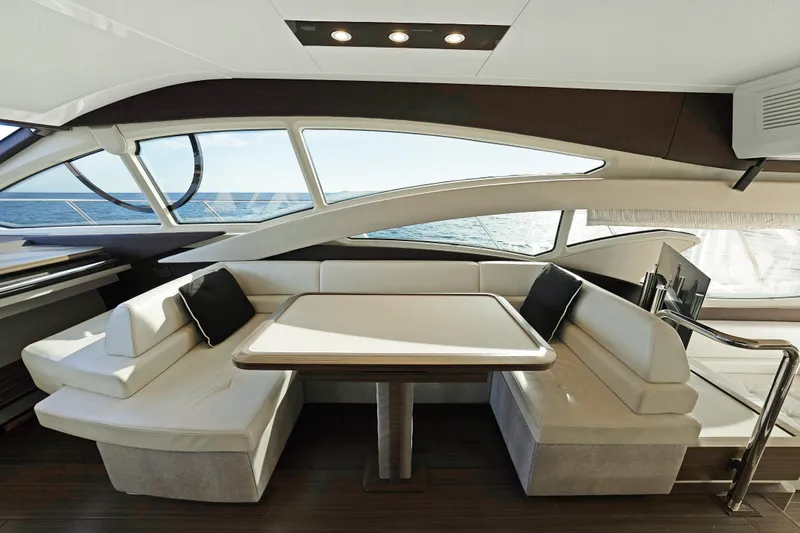 Acciaio Blu Yacht Photos Pics Luxurious interior of 2017 Azimut 60 Flybridge yacht with elegant seating and ocean view.