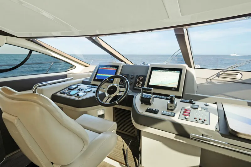 Acciaio Blu Yacht Photos Pics Cockpit of 2017 Azimut 60 Flybridge yacht with modern navigation equipment.