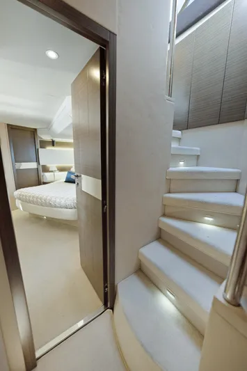 Acciaio Blu Yacht Photos Pics Interior of 2017 Azimut 60 Flybridge yacht with stairs and bedroom view.