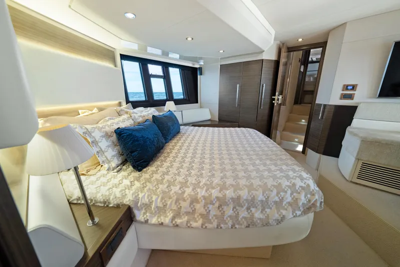 Acciaio Blu Yacht Photos Pics Luxurious bedroom interior of 2017 Azimut 60 Flybridge yacht with modern design and cozy bedding.