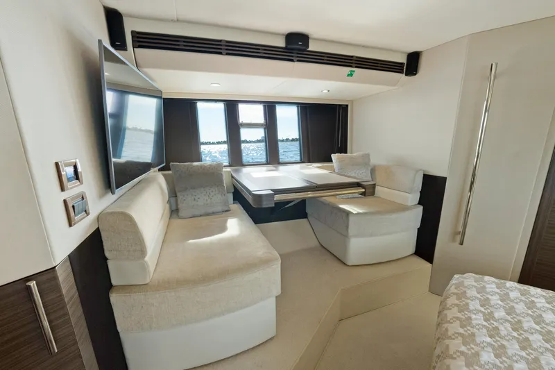 Acciaio Blu Yacht Photos Pics Luxurious interior of 2017 Azimut 60 Flybridge yacht with elegant seating and panoramic windows.