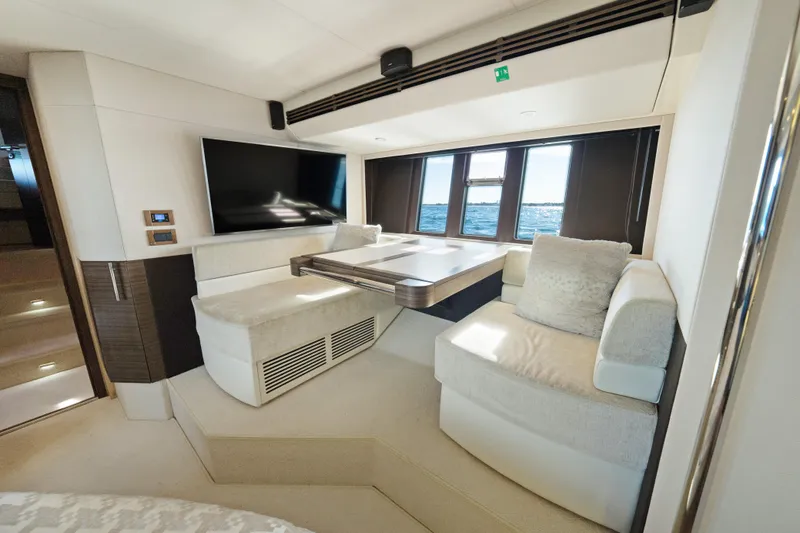 Acciaio Blu Yacht Photos Pics Luxurious interior of 2017 Azimut 60 Flybridge yacht with plush seating and large windows.