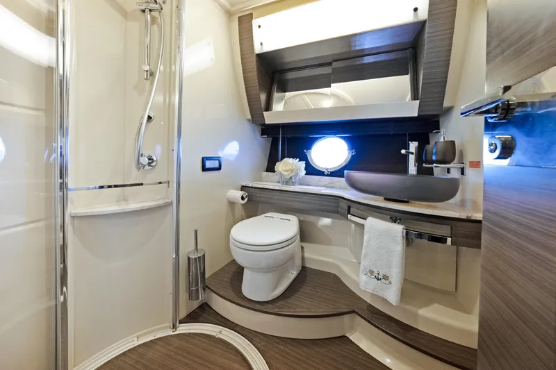 Acciaio Blu Yacht Photos Pics Luxurious bathroom in 2017 Azimut 60 Flybridge yacht with modern fixtures and elegant design.