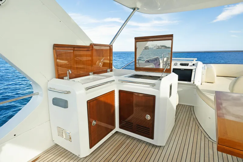 Acciaio Blu Yacht Photos Pics Luxurious 2017 Azimut 60 Flybridge yacht with elegant outdoor kitchen and ocean view.