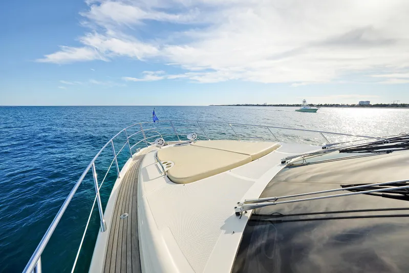 Acciaio Blu Yacht Photos Pics 2017 Azimut 60 Flybridge yacht cruising on open sea under clear skies.