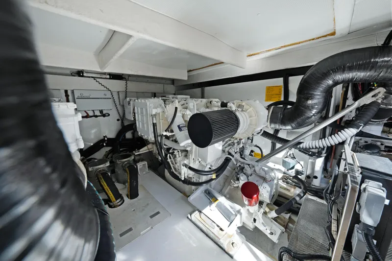 Acciaio Blu Yacht Photos Pics Engine room of 2017 Azimut 60 Flybridge yacht, showcasing mechanical components and systems.