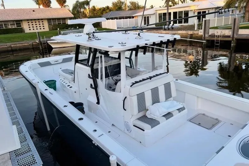  Yacht Photos Pics 2022 Invincible 35 Catamaran docked, featuring spacious deck and modern design.