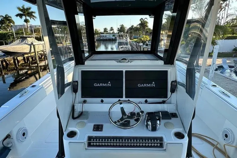  Yacht Photos Pics Cockpit of 2022 Invincible 35 Catamaran with Garmin displays and steering wheel.
