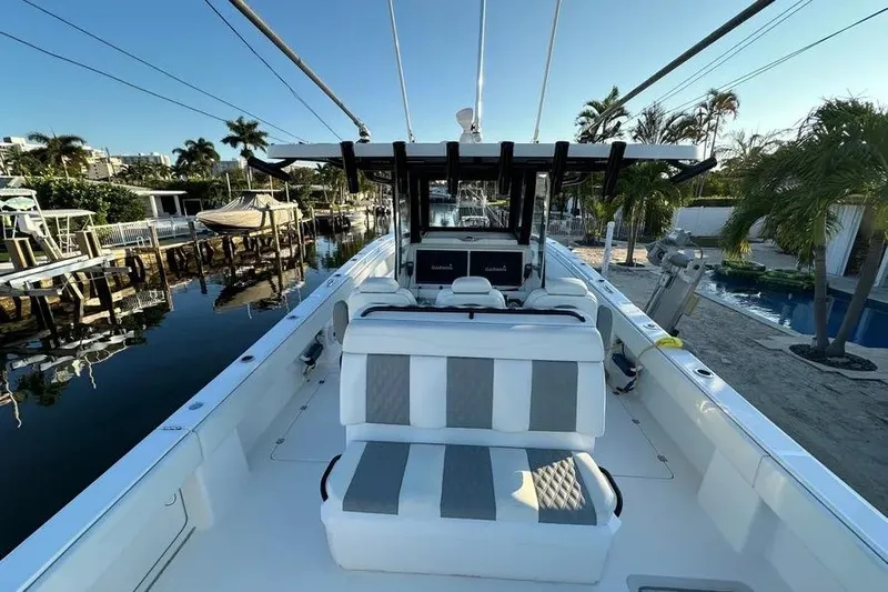  Yacht Photos Pics 2022 Invincible 35 Catamaran docked, showcasing spacious seating and modern design.