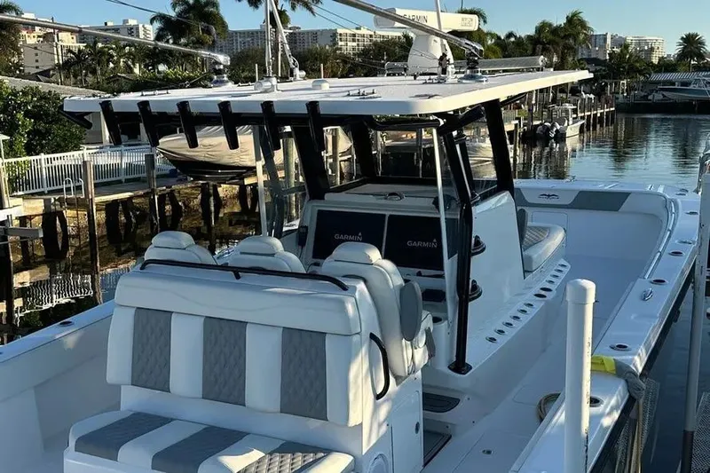  Yacht Photos Pics 2022 Invincible 35 Catamaran docked, featuring sleek design and modern equipment.