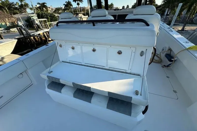  Yacht Photos Pics 2022 Invincible 35 Catamaran interior with white seating and storage compartments.