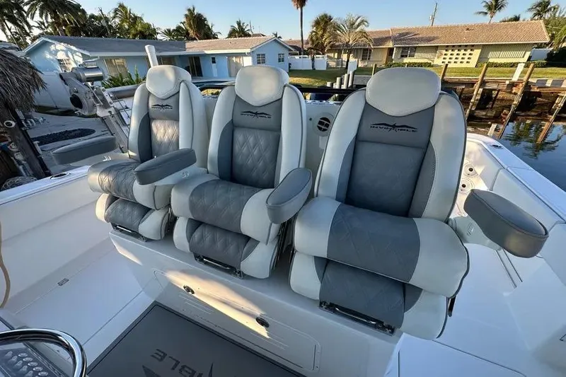  Yacht Photos Pics 2022 Invincible 35 Catamaran luxury seating with gray and white upholstery.