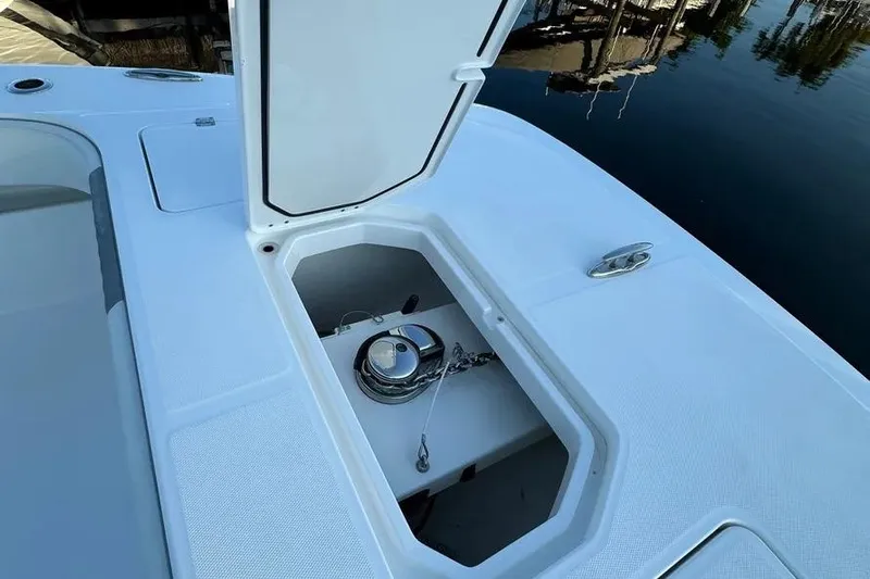  Yacht Photos Pics Open anchor compartment on 2022 Invincible 35 Catamaran, showing chain and winch.