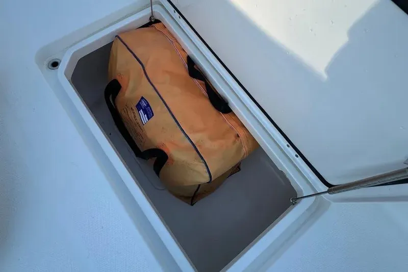  Yacht Photos Pics Storage compartment on 2022 Invincible 35 Catamaran with orange bag inside.